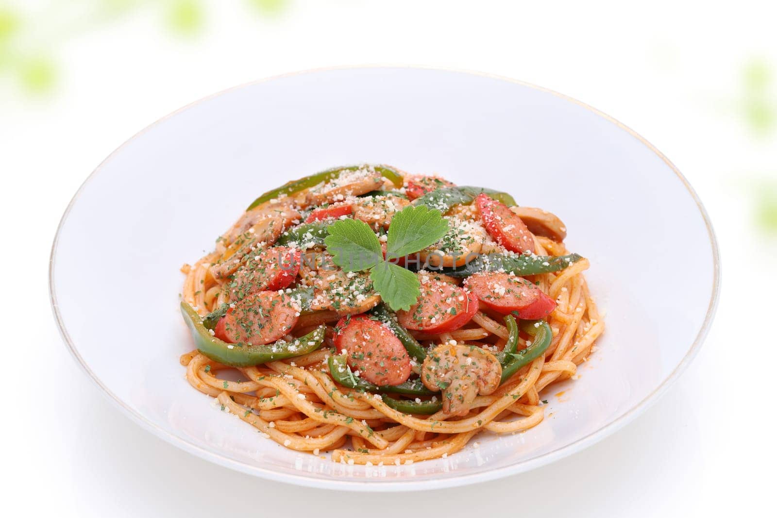 Japanese Naporitan spaghetti with tomato sauce in a dish on white background