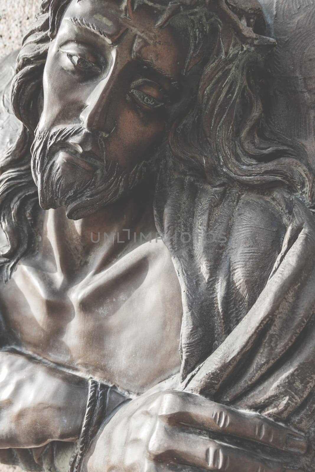Vintage photo style. Fragment of Jesus Christ statue as a symbol of love, faith and religion.