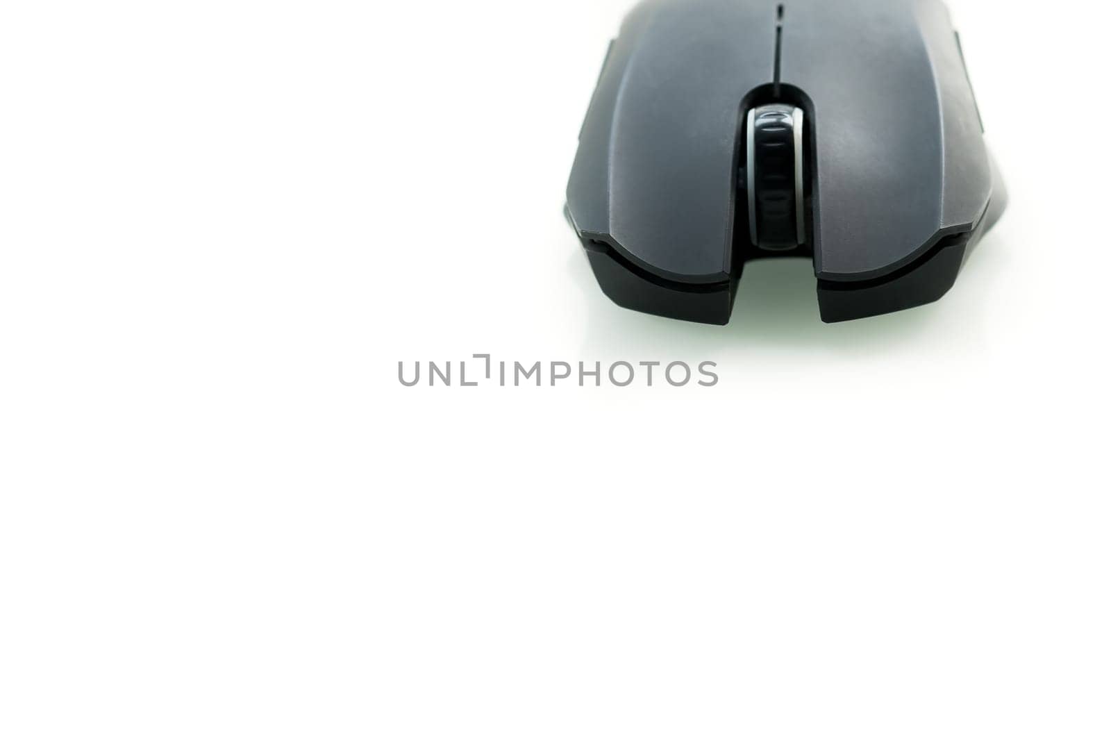 Wireless black computer mouse isolated on white background, closeup frontview