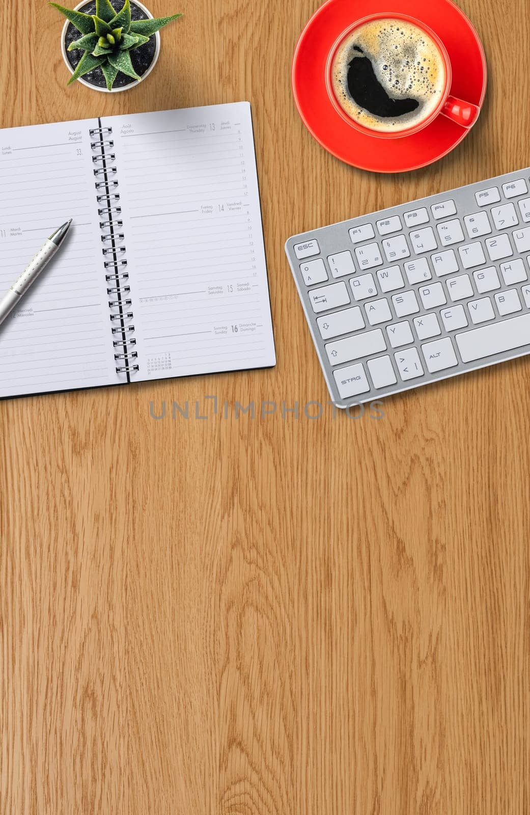 Top view of a workplace with office supplies and copy space on the bottom