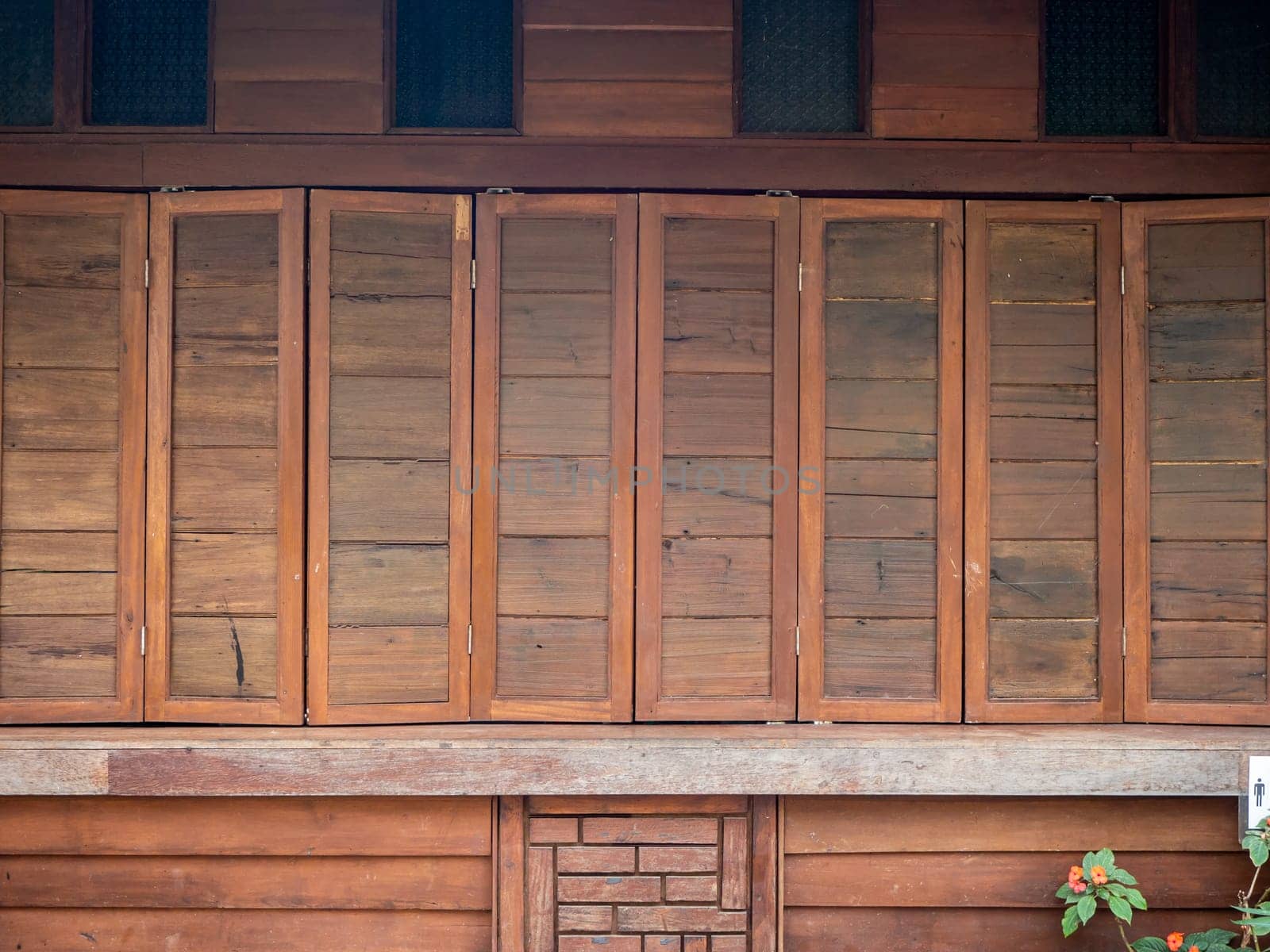 The wood wall and window on stones basement