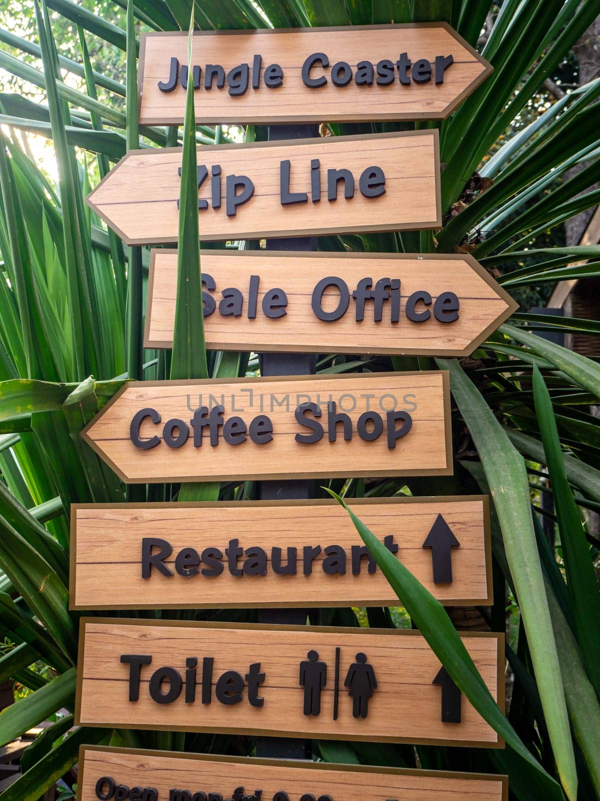wooden label hanging at wooden pole