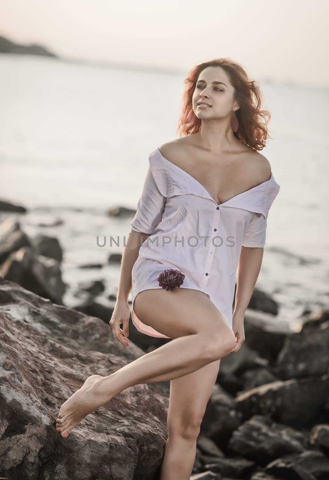 Portrait of a beautiful sexy woman outdoor. Model near the sea