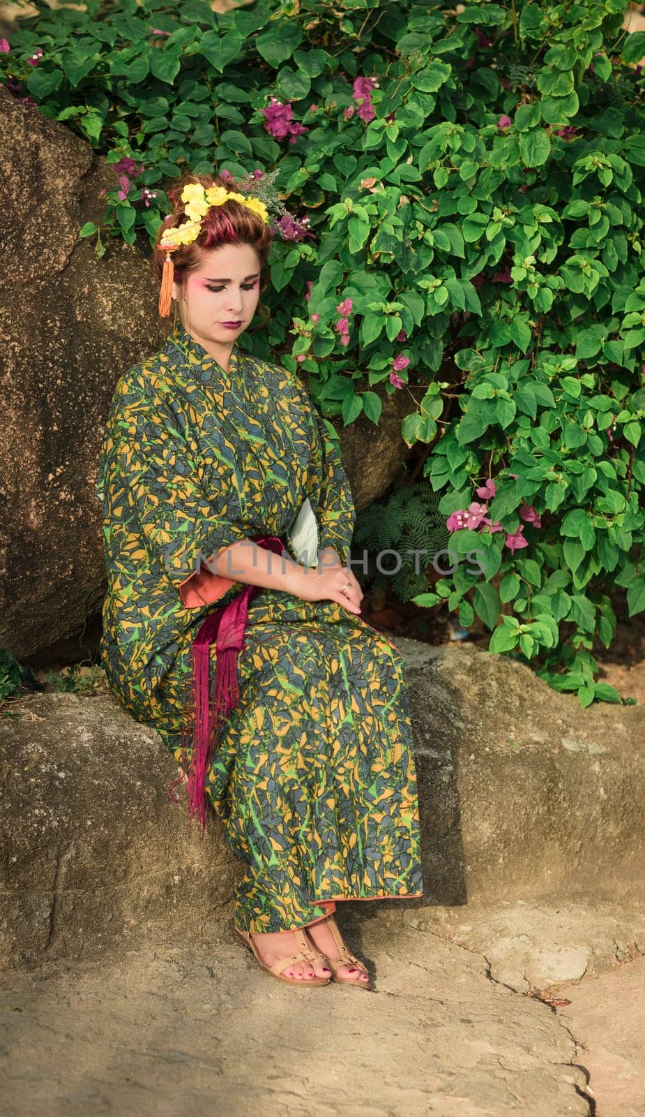 Fine art portrait of beautiful woman in Japanese Geisha style wearing kimono
