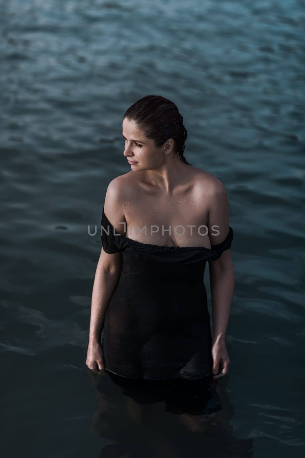 Portrait of a beautiful sexy woman outdoor. Model near the sea