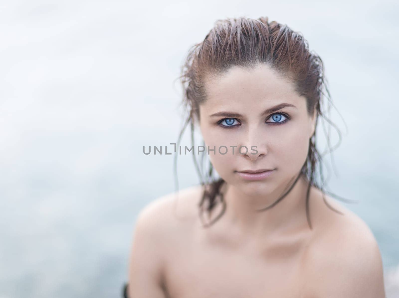 Portrait of a beautiful sexy woman outdoor. Model near the sea