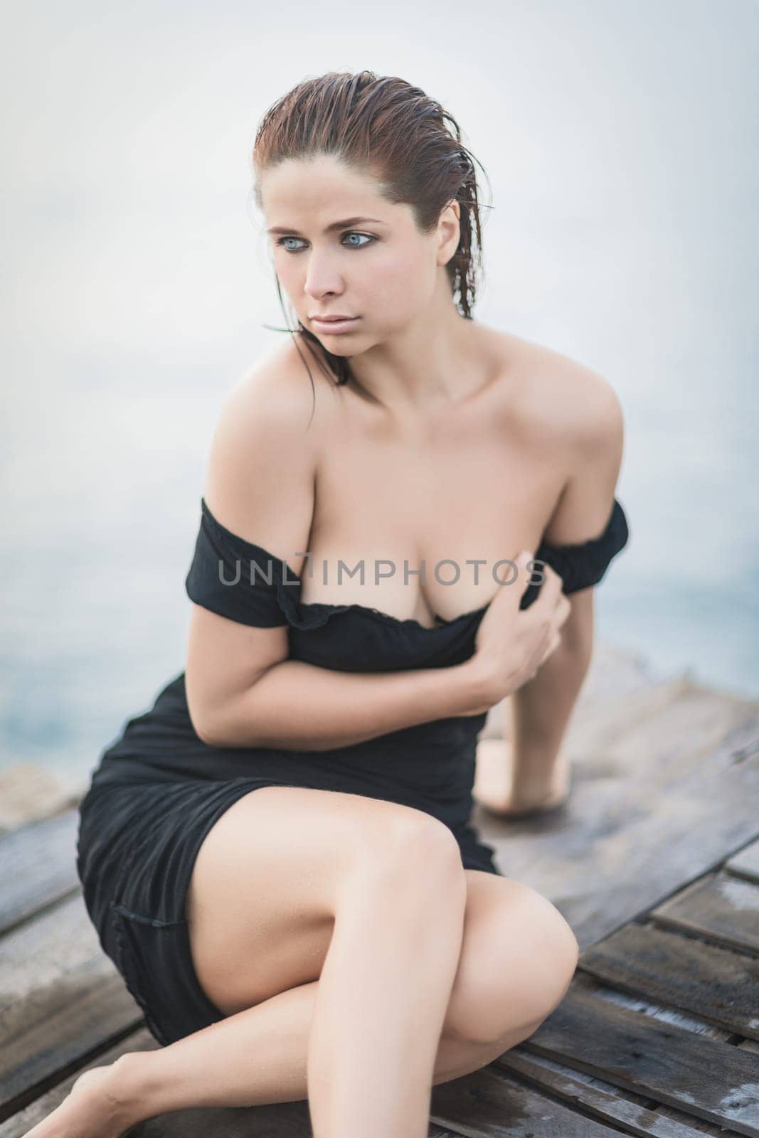 Portrait of a beautiful sexy woman outdoor. Model near the sea