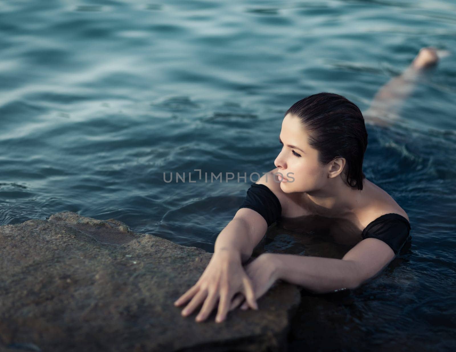 Portrait of a beautiful sexy woman outdoor. Model near the sea