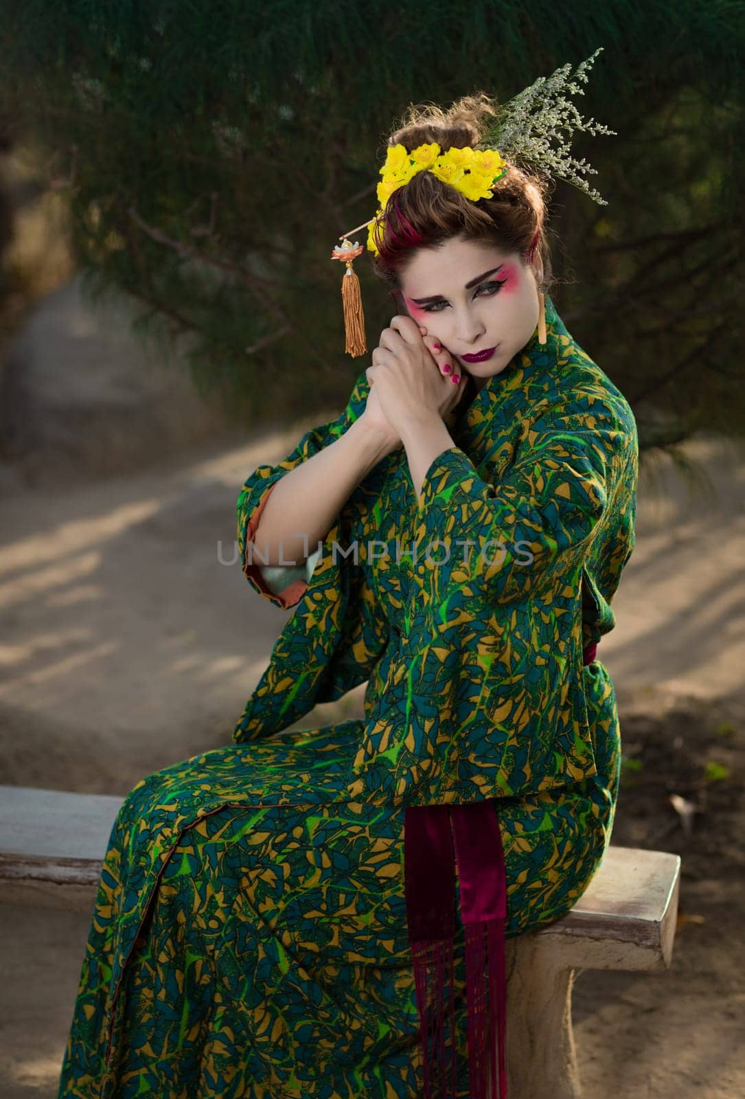 Fine art portrait of beautiful woman in Japanese Geisha style wearing kimono