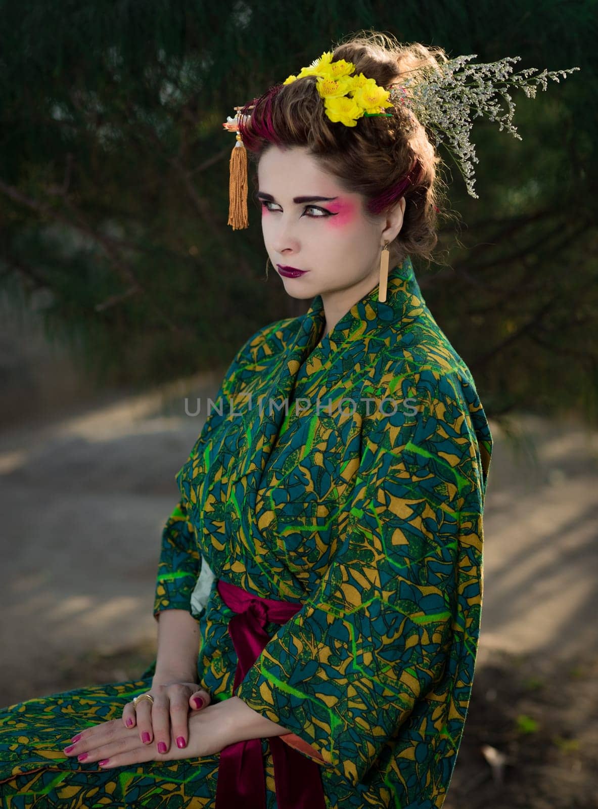Fine art portrait of beautiful woman in Japanese Geisha style wearing kimono