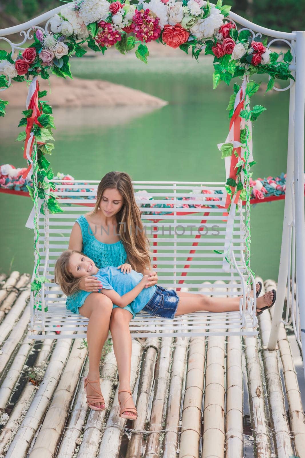 Outdoor portrait of a beautiful happy family. Mother and daughter together