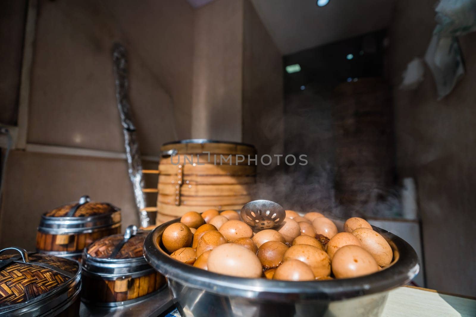 A view of freshly-boiled eggs with steam in a rural kitchen captured under the sunlight