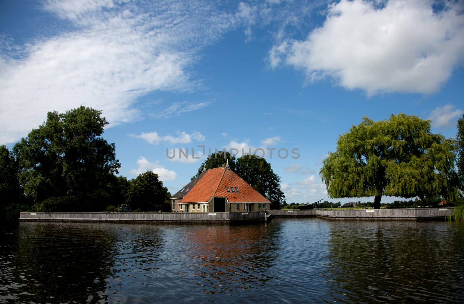 Terhorne, The Netherlands - July, 9 2019, Farm on the waterfront, the Netherlands..