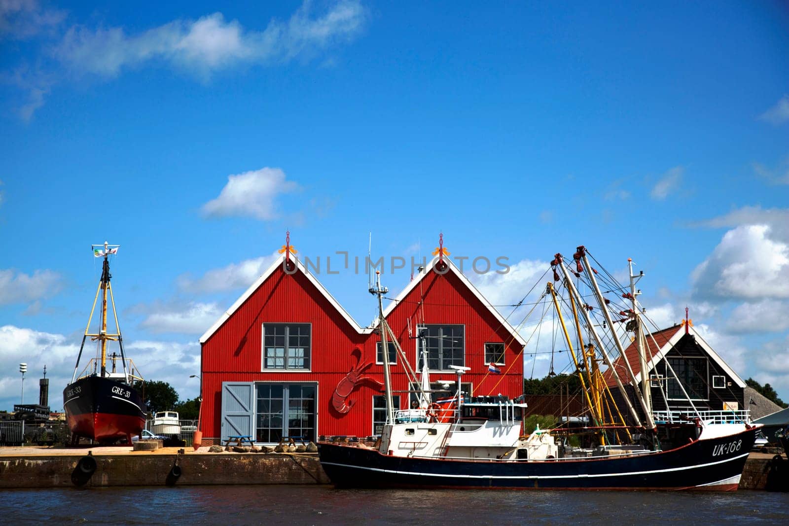 Zoutkamp, Groningen, The Netherlands - July 3 2019, Fishing boats moored at the harbor of Zoutkamp in Groningen, the Netherlands..