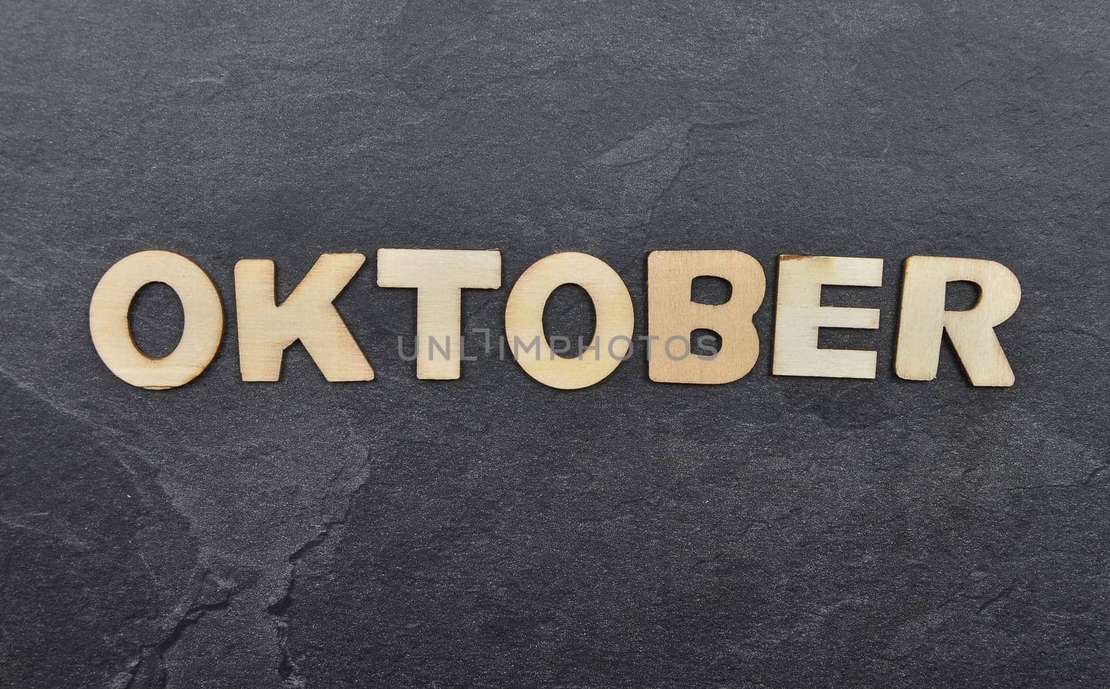 Term from wooden letters on slate board
