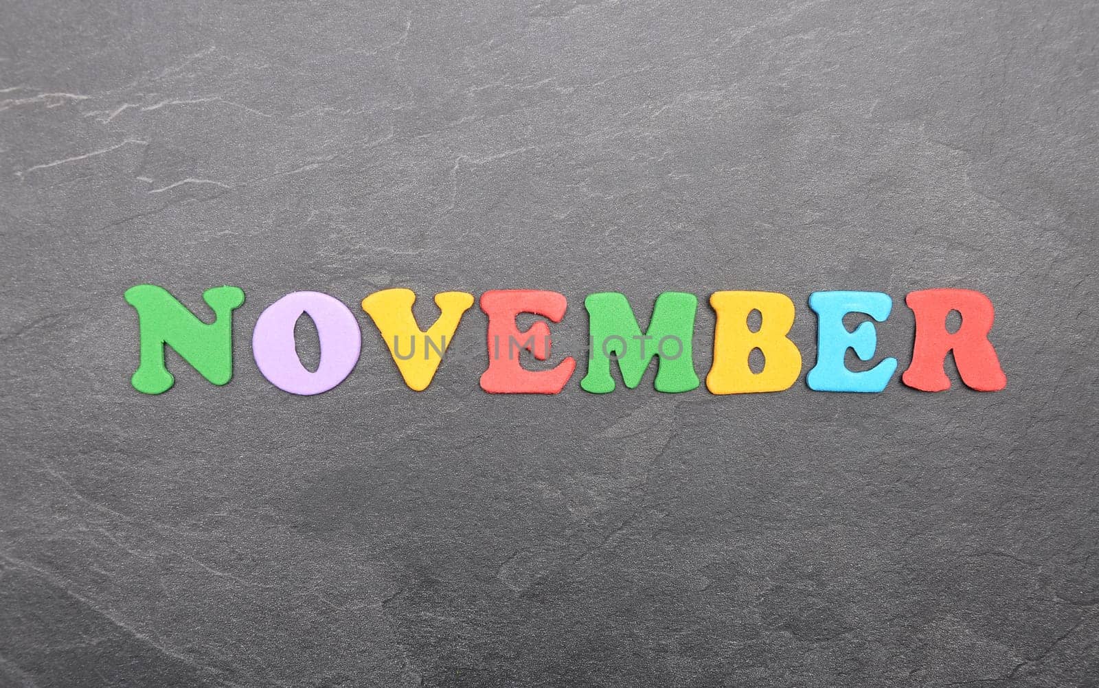 Term from colorful letters on slate board
