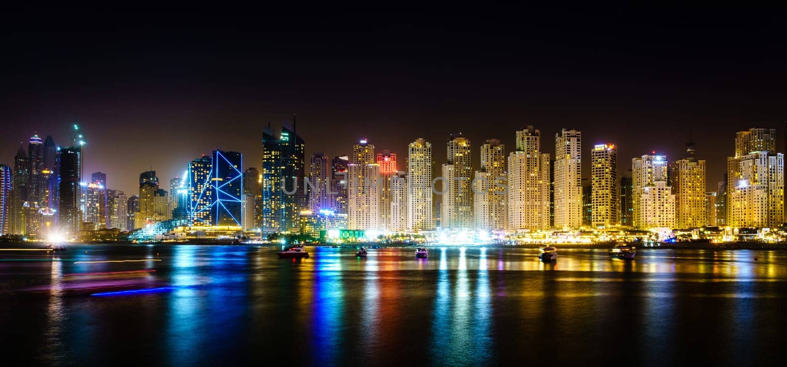 Nighttime view of Dubai Marina and Jumeirah Beach Residence skyline in 2019