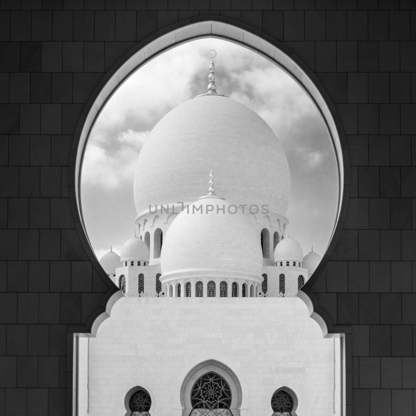 View of main dome of the Sheikh Zayed Grand Mosque framed by an arch. Abu Dhabi, UAE