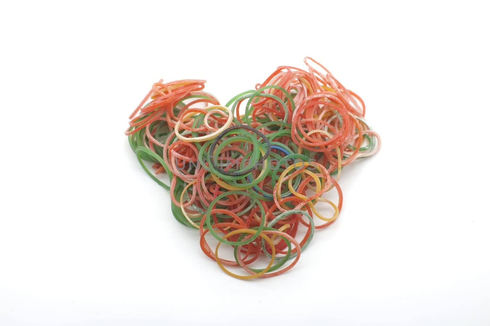 Colorful rubber bands for making rainbow loom bracelets in heart shape isolated on white background