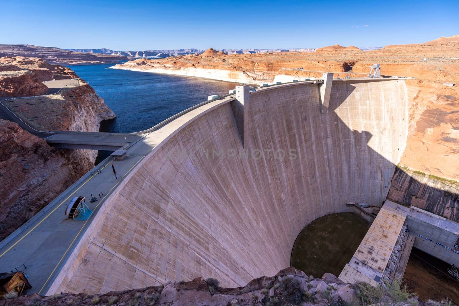 Glen Canyon Dam with Lake Powell in the Desert rural area of Page city Arizona, United States. USA Landmark environmental water resources reservoir and electricity concept.