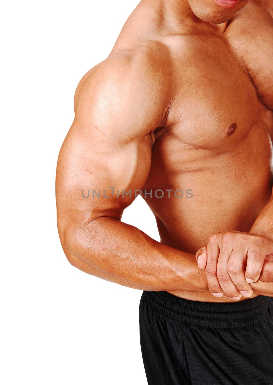 A close up image of the chest and arm of a young man flexing his.biceps and chest, isolated for white background.