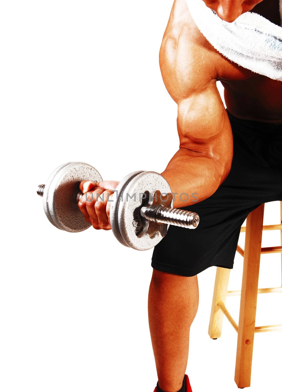 The arm of a young man working out with a dumbbell, sitting on a chair.to do his exercise, isolated for white background.
