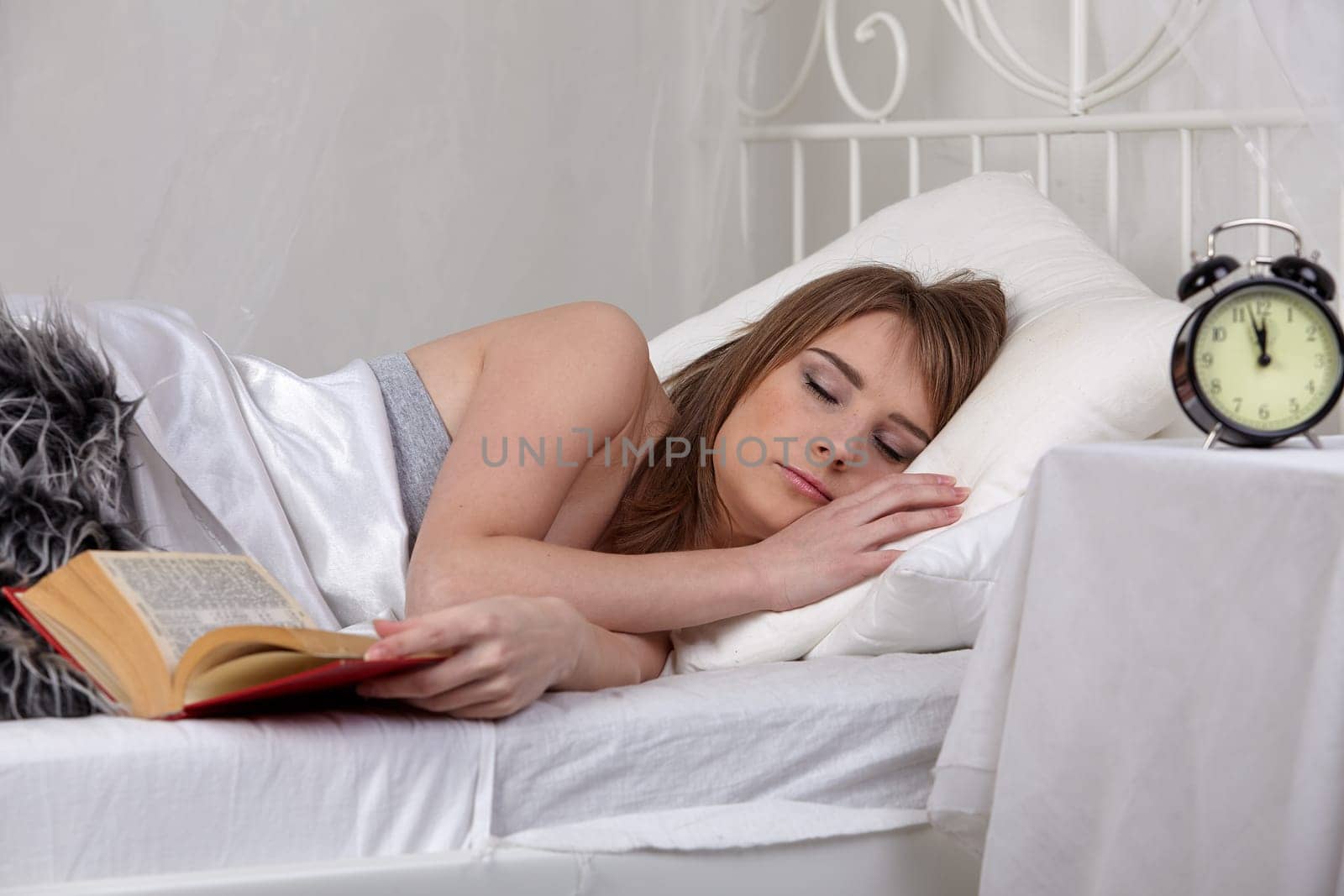 Portrait of beautiful young woman sleeping in  bed at home.