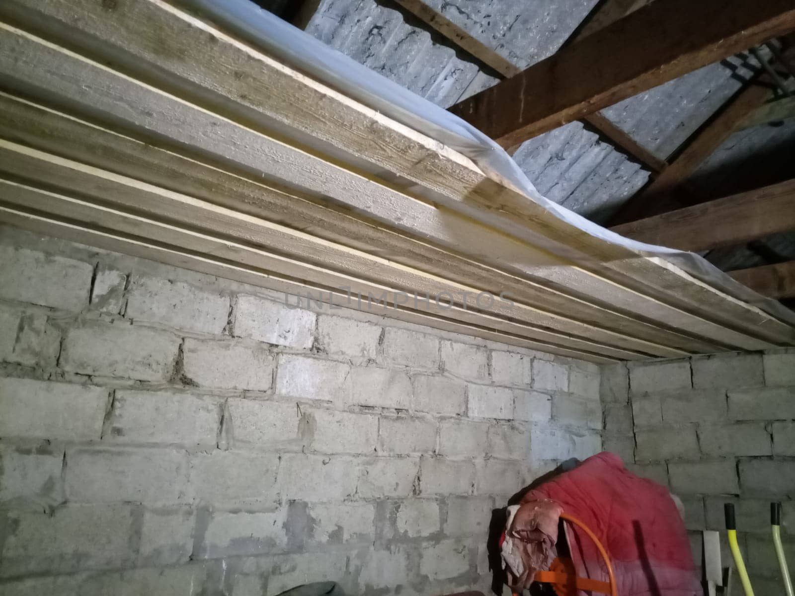 Hemming the ceiling with boards. Ceiling construction.