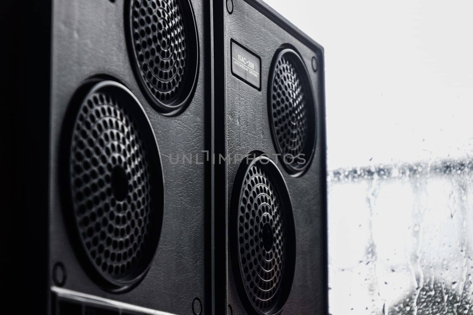 Krasnodar, Russia - April 11, 2020: Vintage speakers by the window. Column speaker 15AS-208. Vintage Soviet bookshelf acoustics.