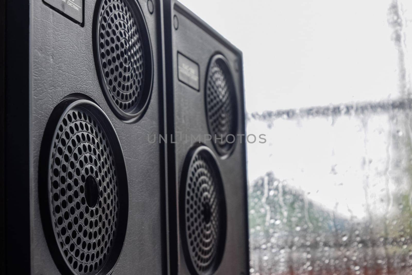 Krasnodar, Russia - April 11, 2020: Vintage speakers by the window. Column speaker 15AS-208. Vintage Soviet bookshelf acoustics.