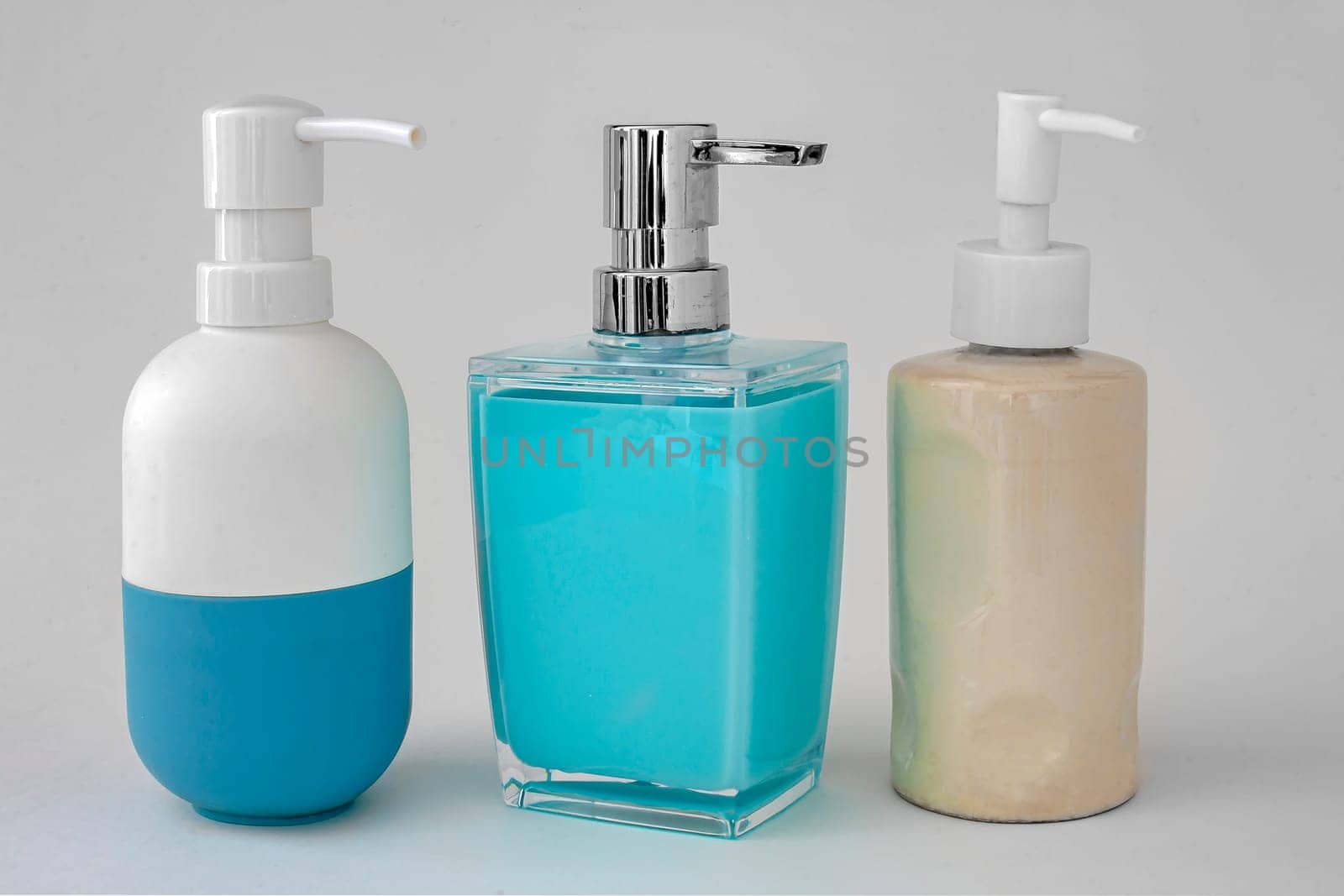 Colorful soap dispenser for bathrooms or kitchen sinks on a white background