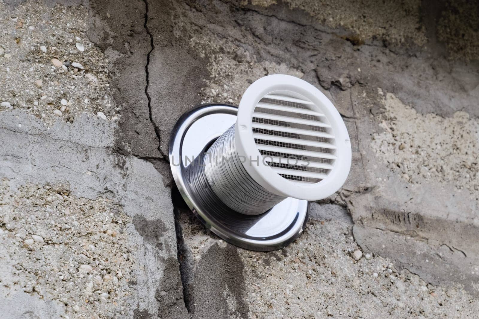 Air vent in the wall from the sauna. Ventilation grill