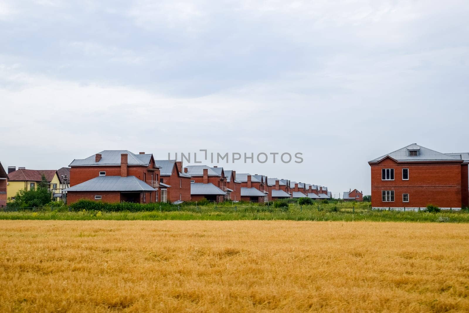 A cottage village of two-storey houses. Low-rise development.