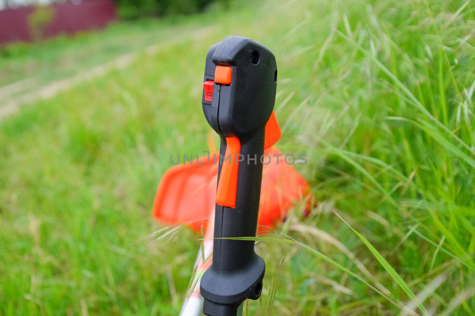 Knob with trimmer controls. Gas trimmer, equipment controls. Trimer gascosis with a leaf for mowing grass and shrubs.