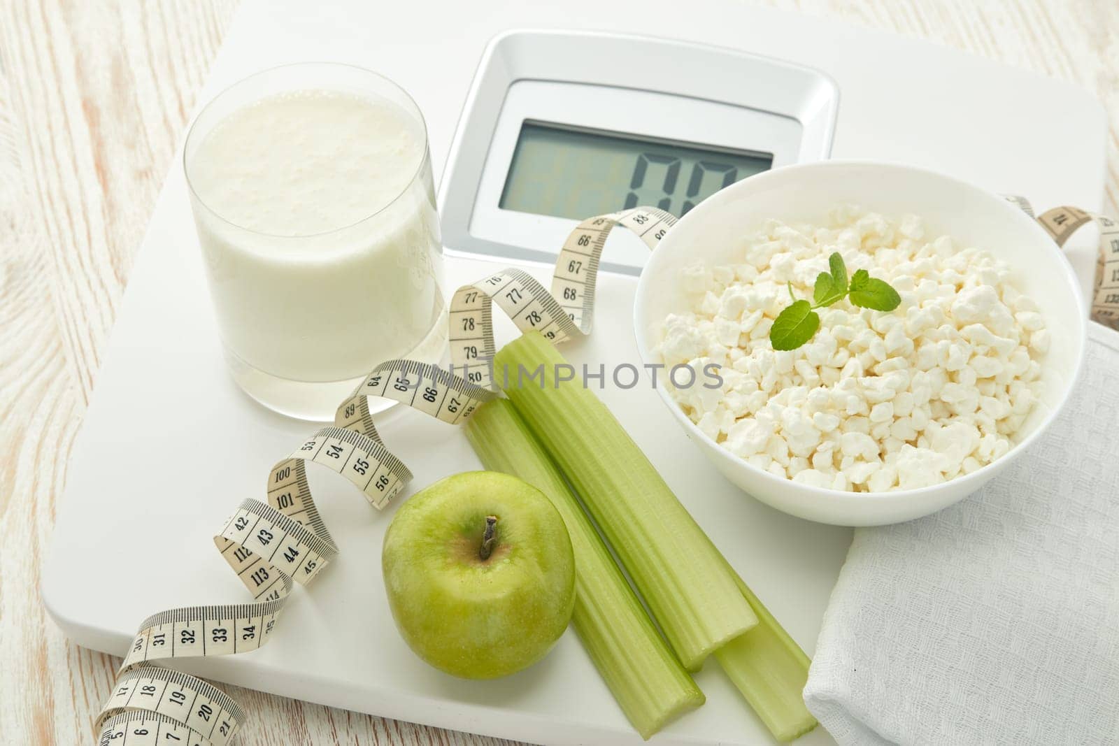 Slimming, diet, and control of weight. Still life with healthy food, scales and measuring tape. Healthy nutrition. Healthy lifestyle concept. Control of weight during the isolation period