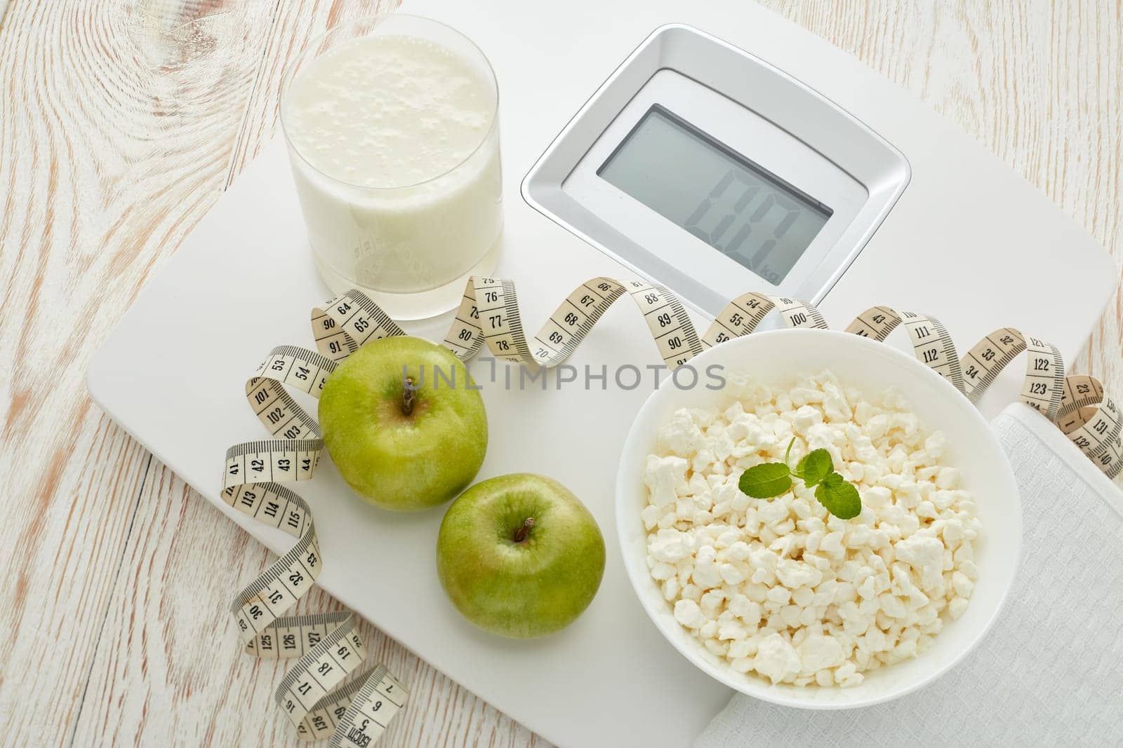 Slimming, diet, and control of weight. Still life with healthy food, scales and measuring tape. Healthy nutrition. Healthy lifestyle concept. Control of weight during the isolation period