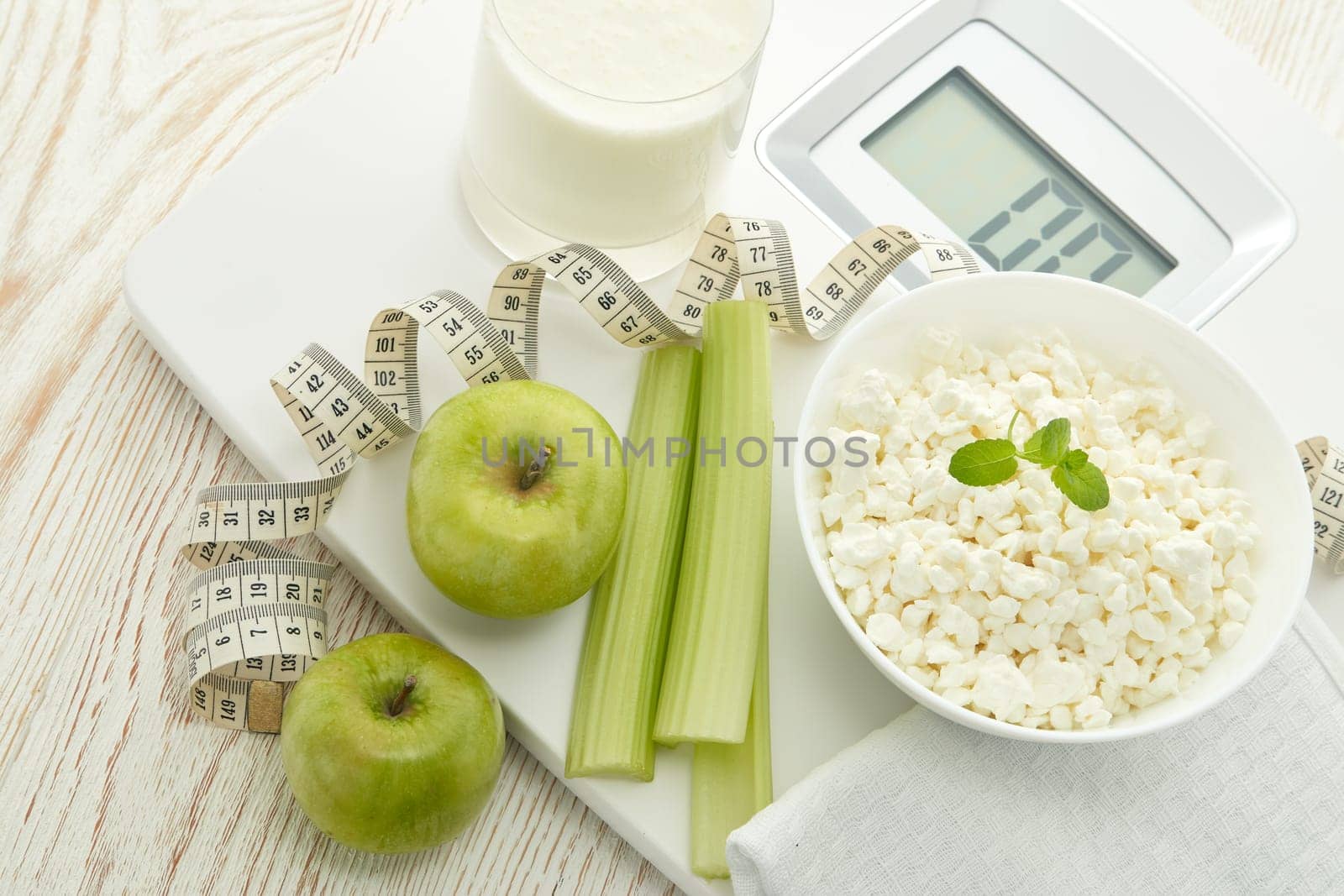Slimming, diet, and control of weight. Still life with healthy food, scales and measuring tape. Healthy nutrition. Healthy lifestyle concept. Control of weight during the isolation period