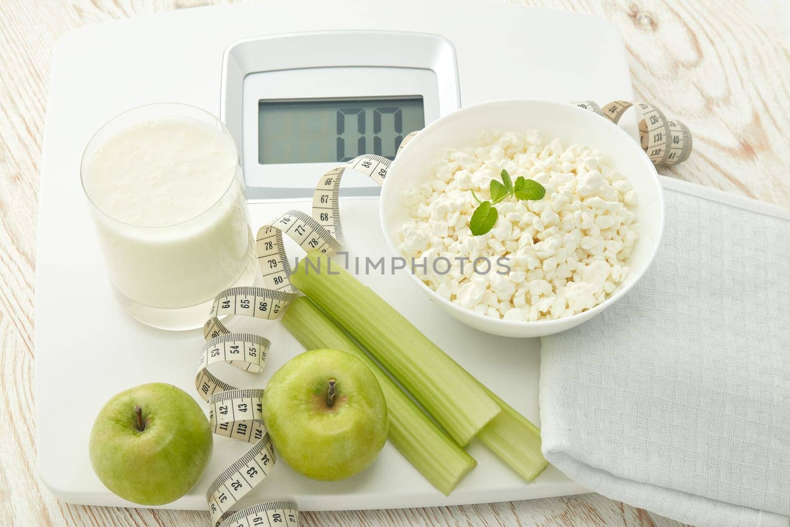 Slimming, diet, and control of weight. Still life with healthy food, scales and measuring tape. Healthy nutrition. Healthy lifestyle concept. Control of weight during the isolation period