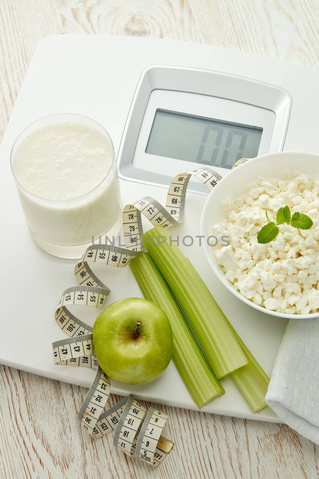 Slimming, diet, and control of weight. Still life with healthy food, scales and measuring tape. Healthy nutrition. Healthy lifestyle concept. Control of weight during the isolation period