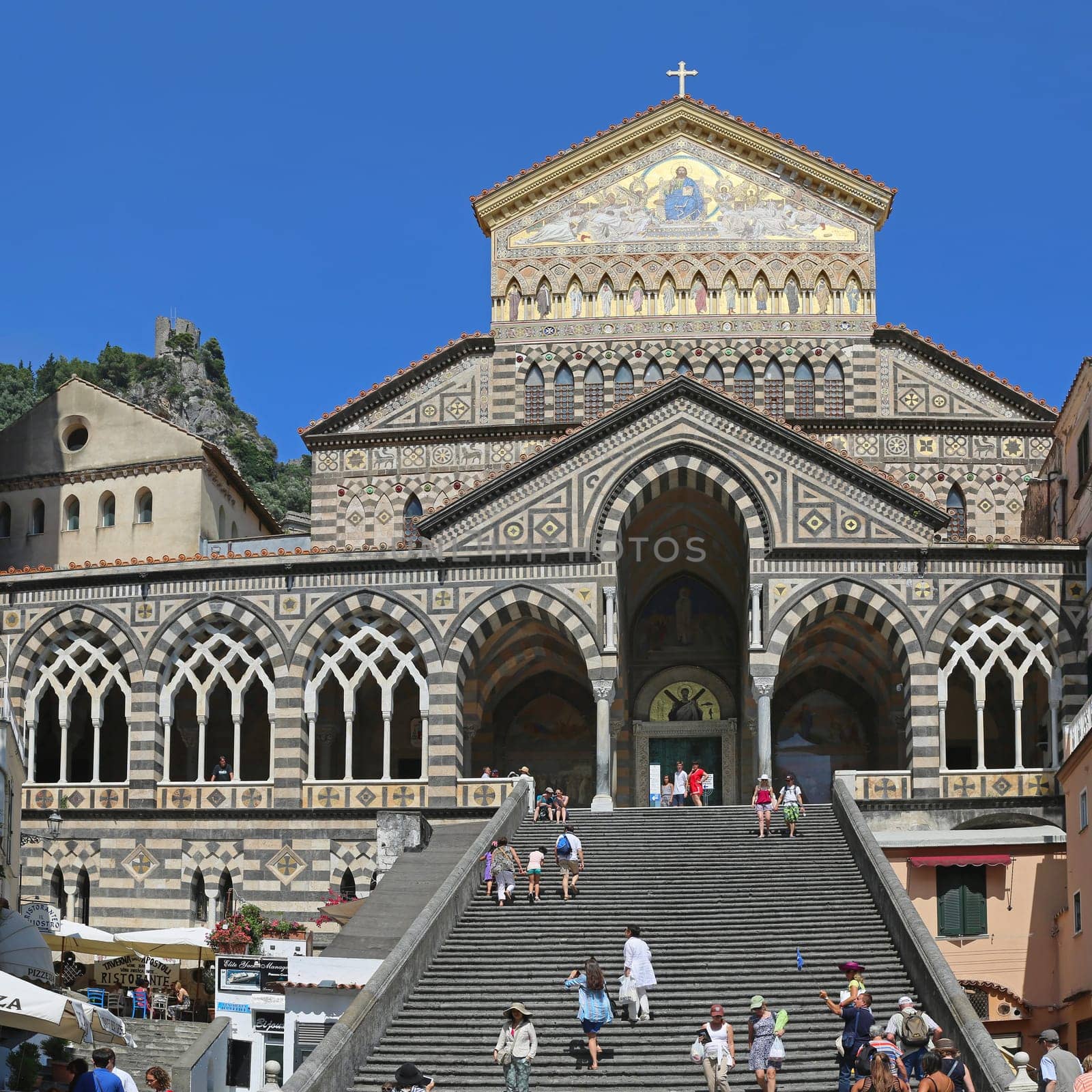 AMALFI, ITALY - JUNE 27: Apostle Saint Andrew Cathedral in Amalfi on JUNE 26, 2014. Tourists at Church Stairway in Amalfi, Italy.
