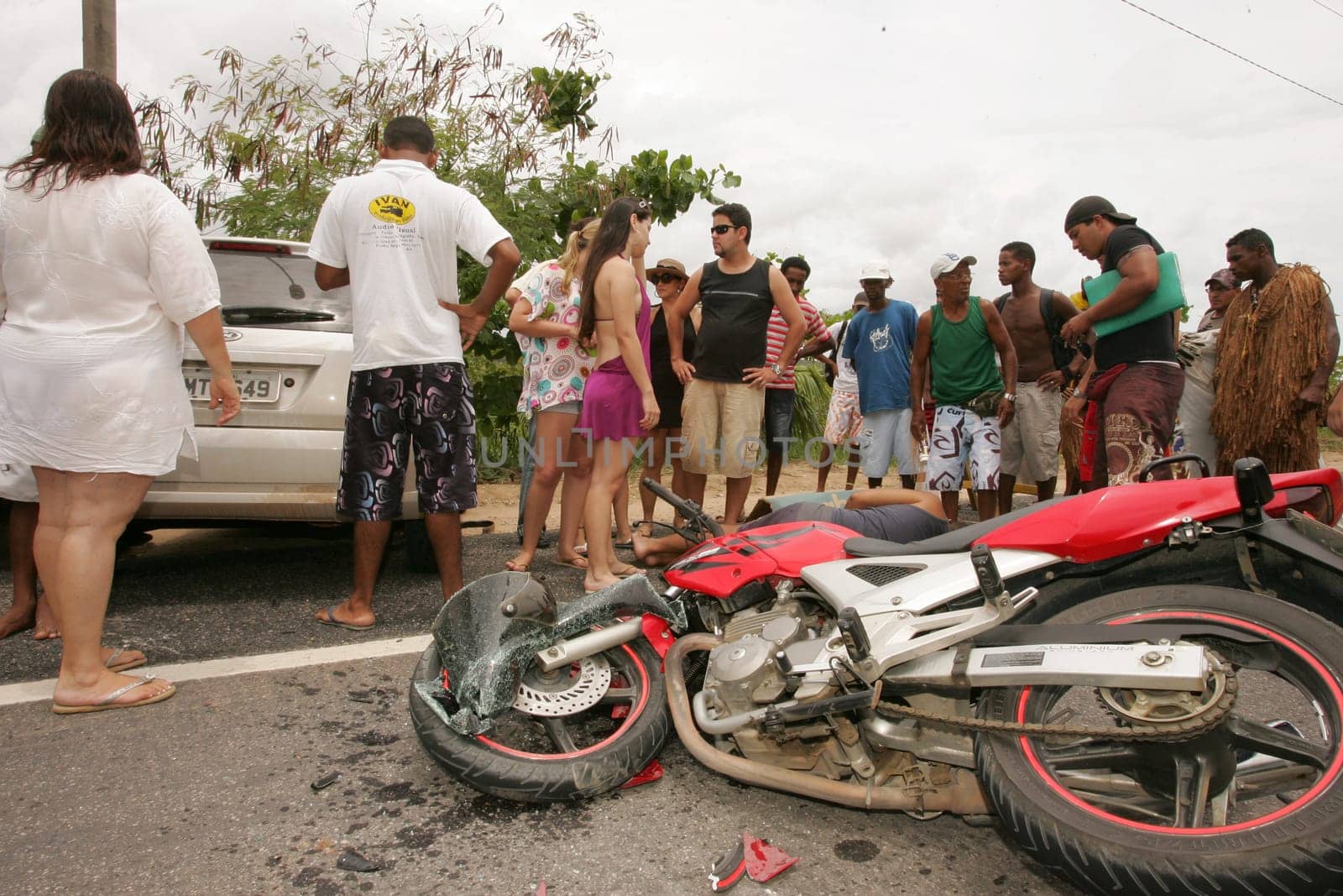 porto seguro, bahia / brazil - december 30, 2010: Samu rescuers service a motorcyclist involved in an accident on the BR 367 highway in Porto Seguro.