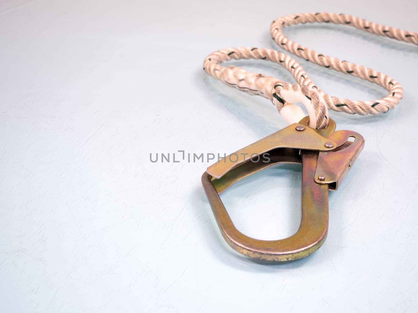 Figure eight knot with carabiner. Silver carabiner with lock andrope isolated on white background.
