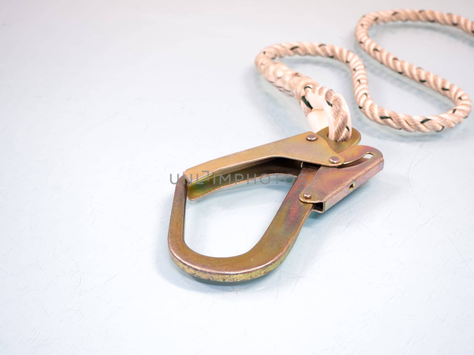 Figure eight knot with carabiner. Silver carabiner with lock andrope isolated on white background.
