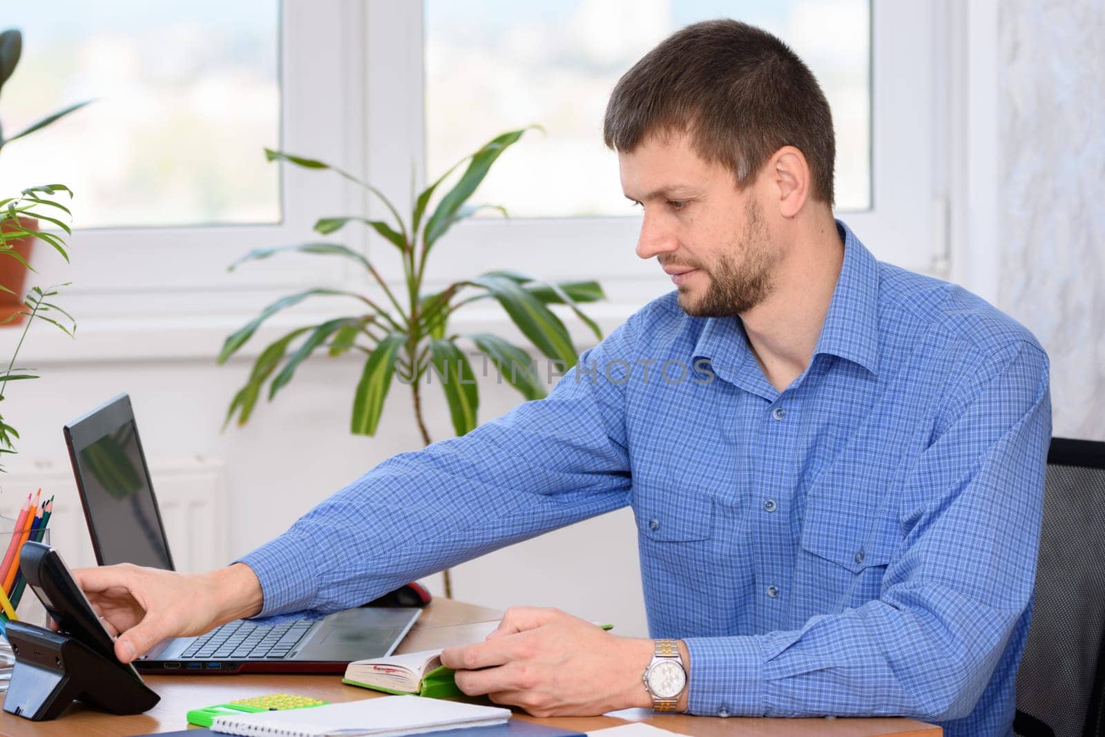 Office employee picks up the a phone