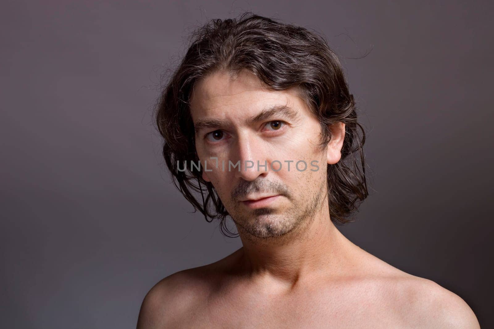 Portrait of young man on a dark background