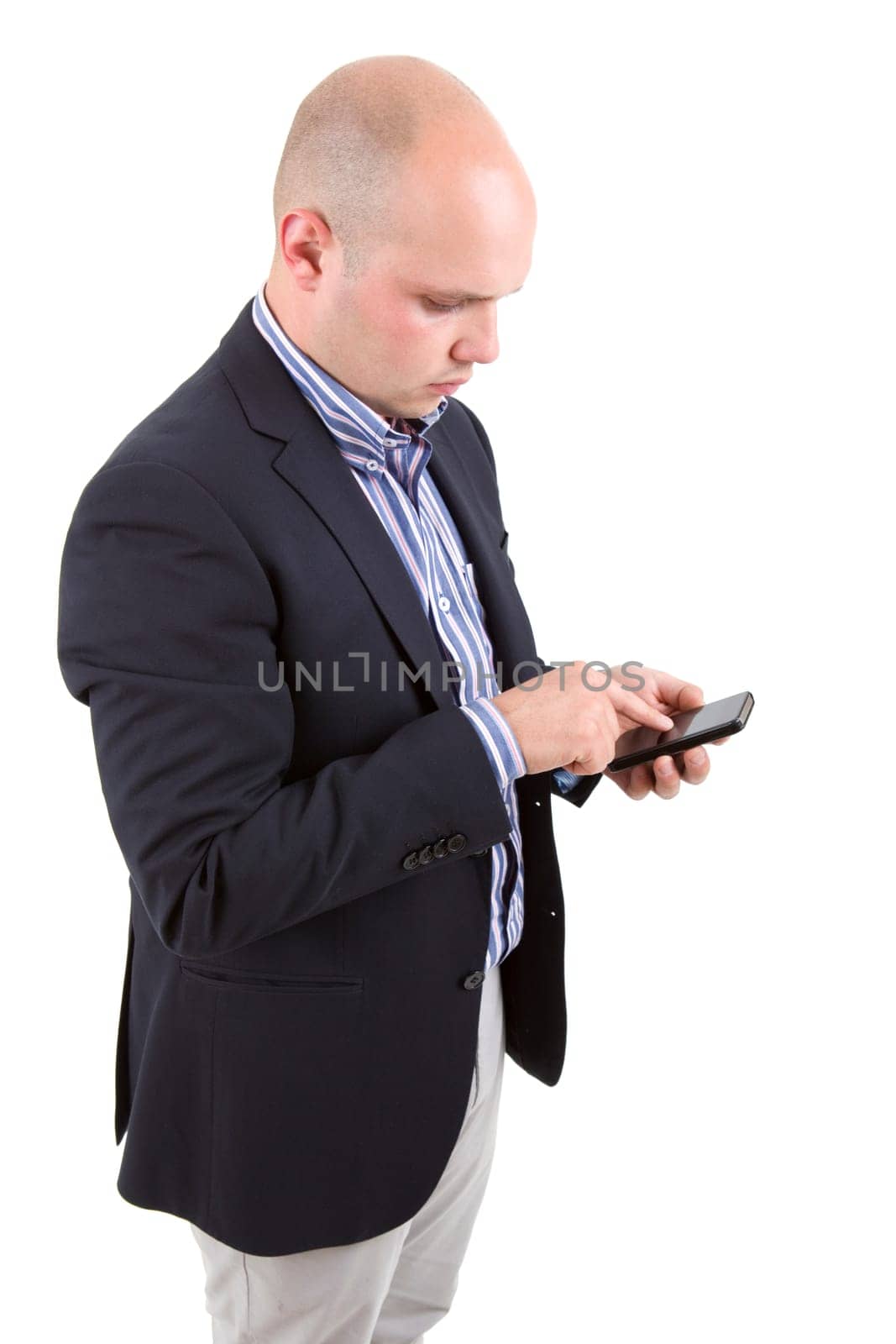 young business man looking to his phone, isolated