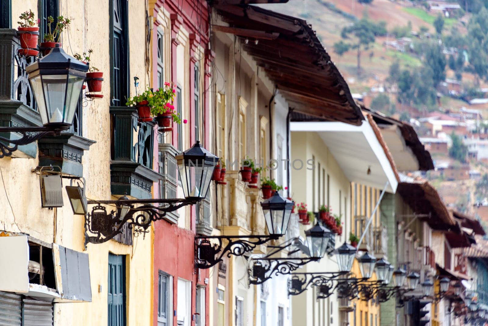 Colonial facades and rows of street lights in Cajamarca, Peru
