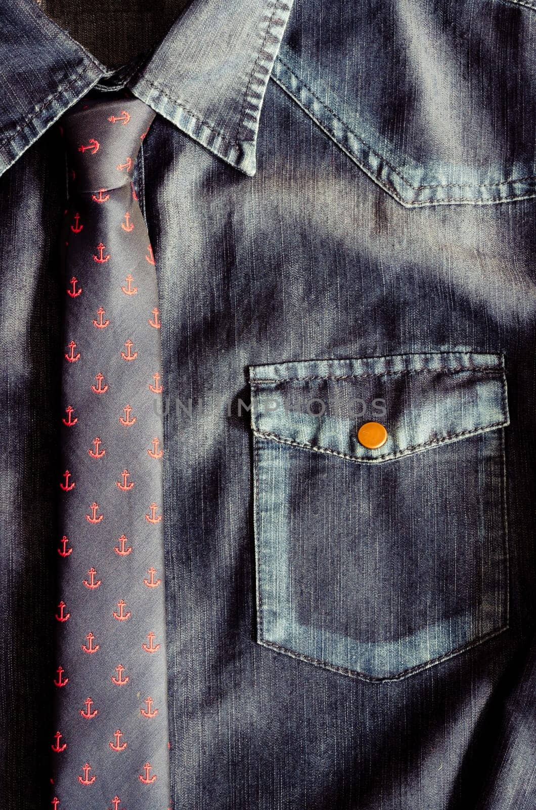 Detail of denim vintage shirt with nice tie