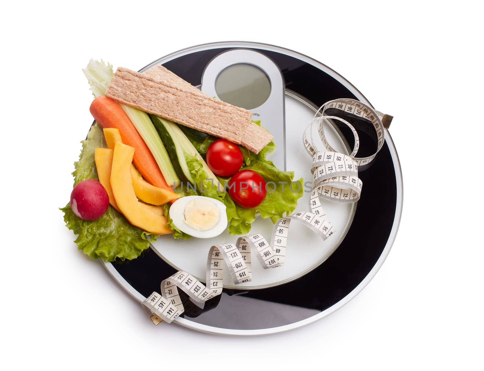 Slimming, diet, and control of weight. Still life with healthy food, scales and measuring tape. Healthy nutrition. Healthy lifestyle concept. Control of weight during the isolation period