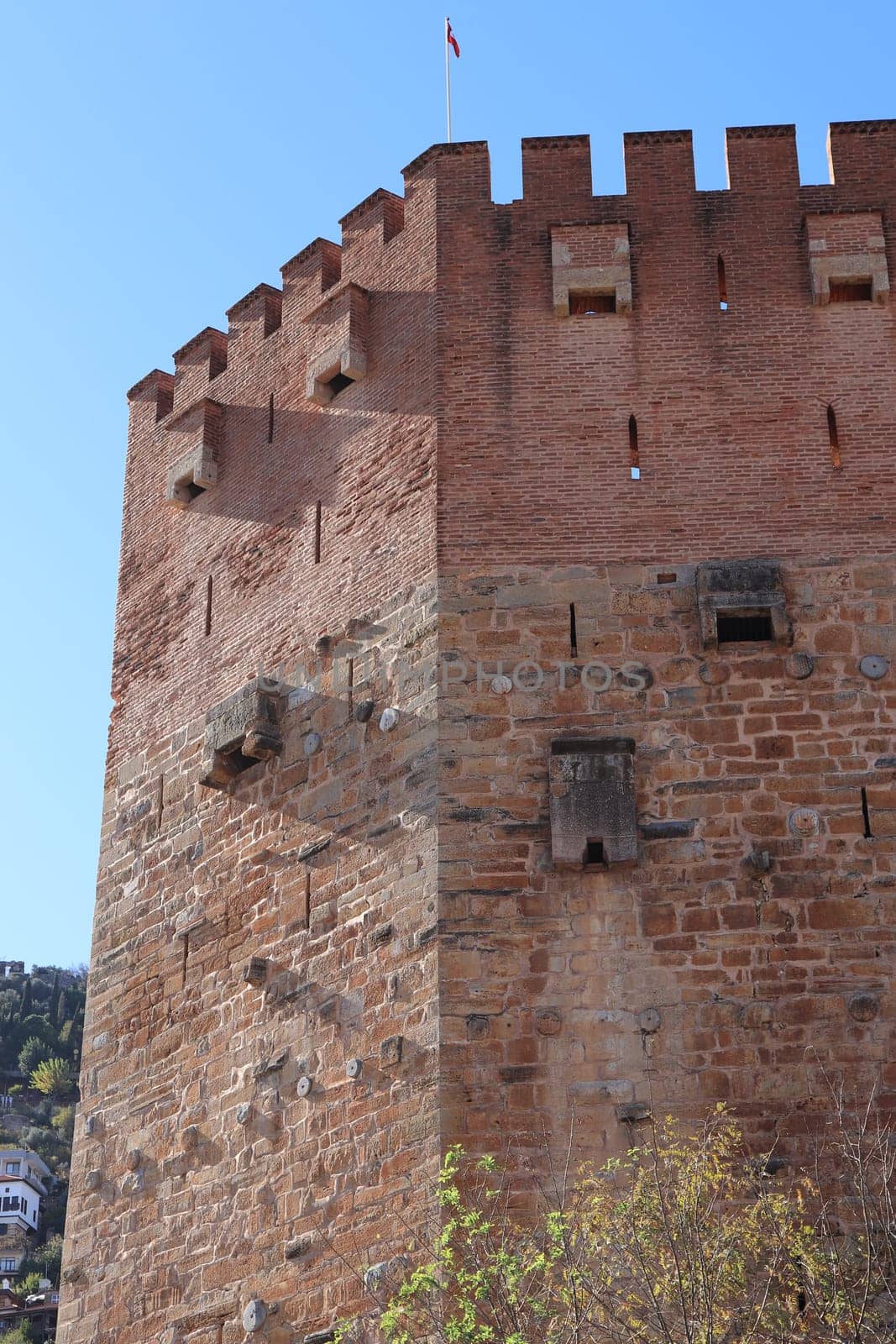Bedesten Alanya fortress. Big red bricks tower. Turkey.